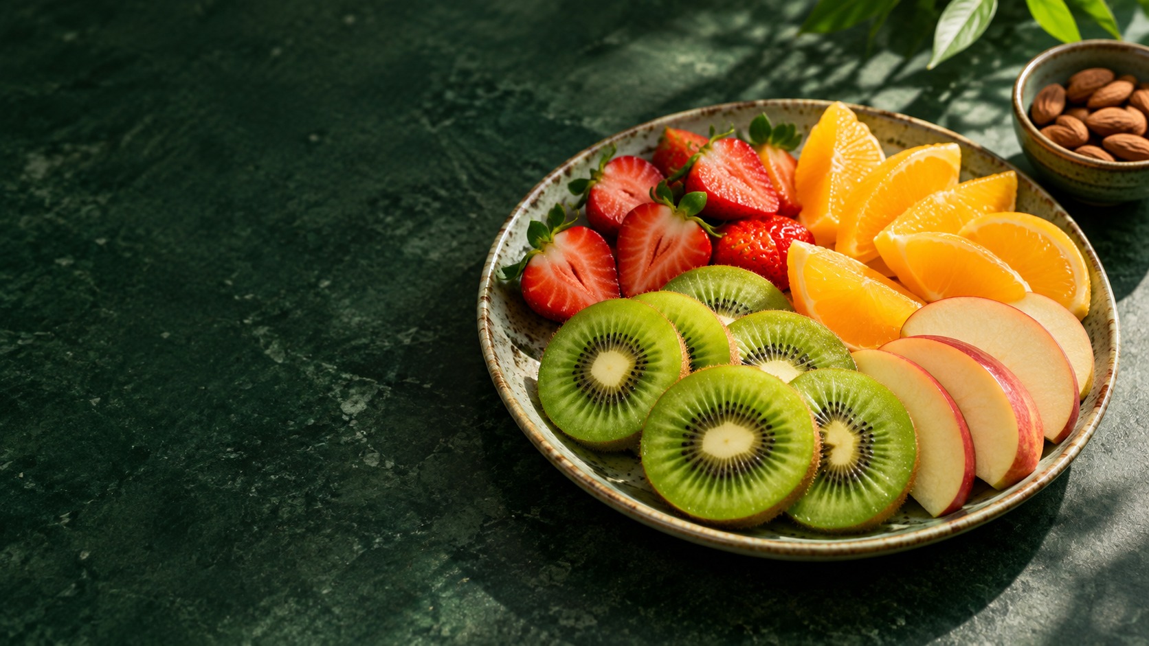 Fresh fruit arranged on a green kitchen counter