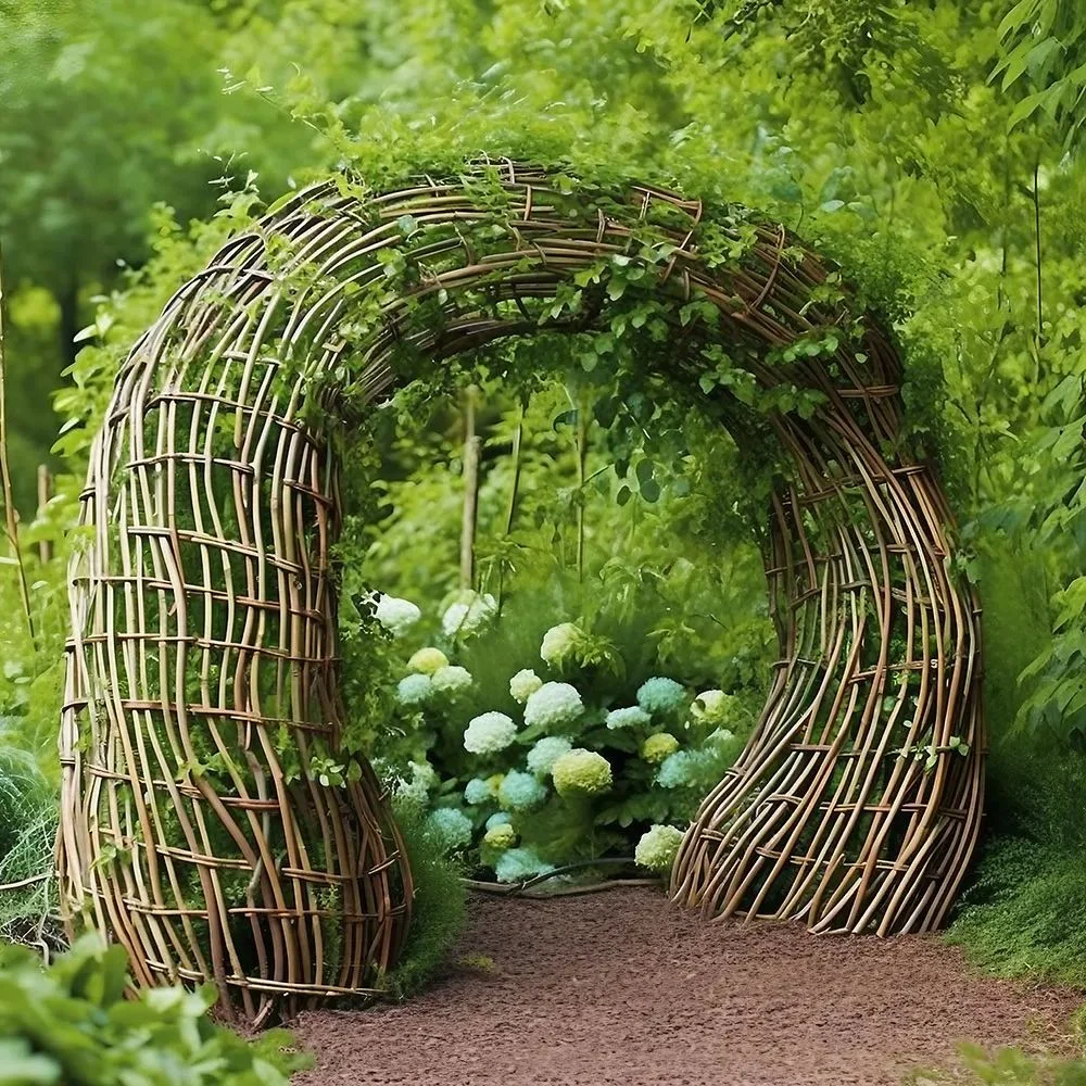 Woven willow garden arch forming a natural pathway surrounded by lush greenery
