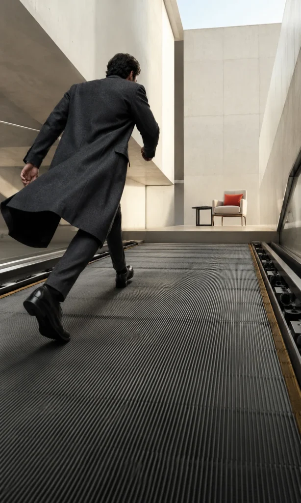 Adult walking forward on a floor moving backward representing altered effort and reward during depression