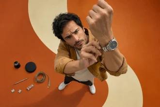 Man adjusting a wristwatch that keeps rotating and sitting incorrectly on his wrist
