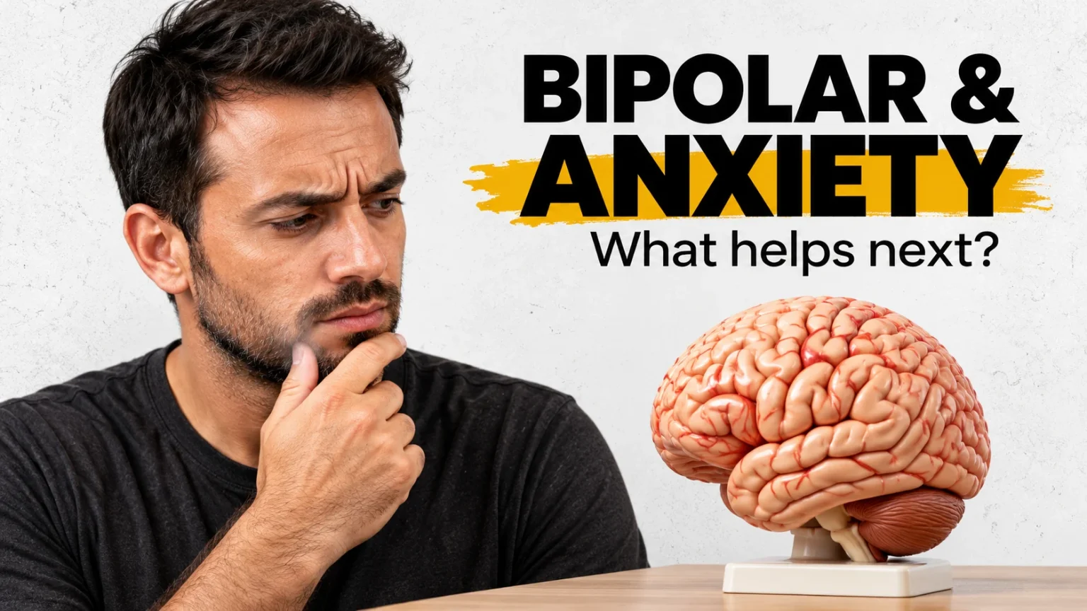 A thoughtful man with furrowed eyebrows rests his hand on his chin beside an educational brain model and the headline Bipolar and Anxiety.